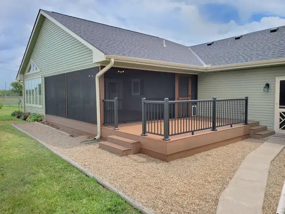 Screened porch and composite deck on a home with sage siding