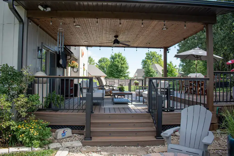A PDQ covered deck with a pergola, ceiling fan and outdoor seating