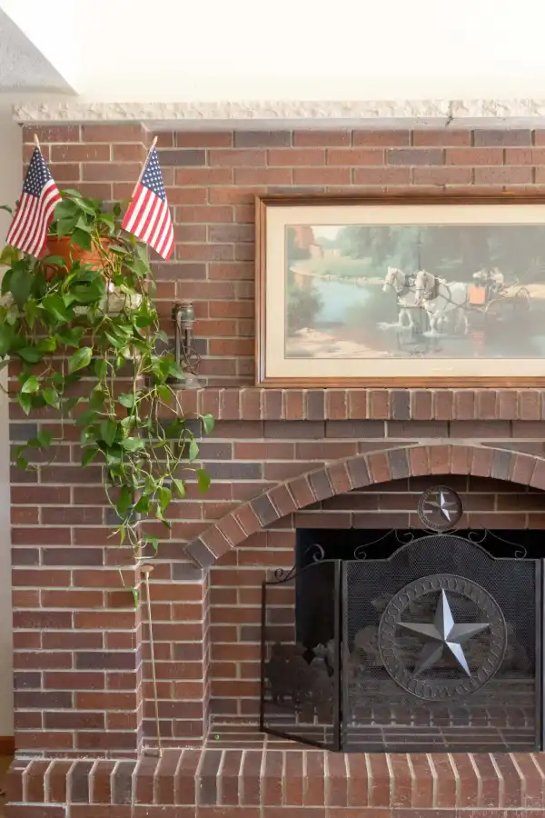 Close view of a brick fireplace face and hearth detail