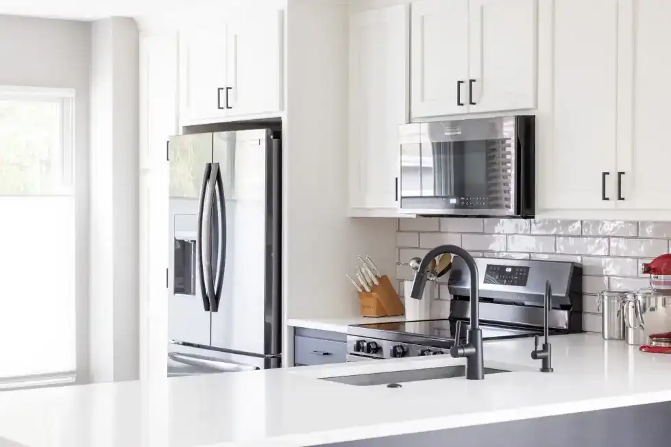 Finished PDQ kitchen remodel with white and blue-grey cabinets