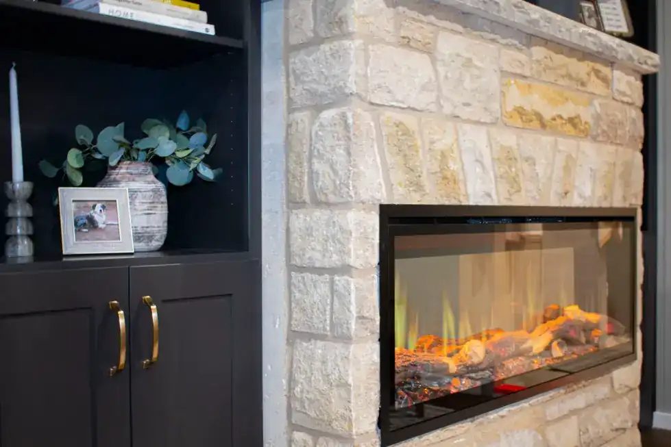 Living room with a stone fireplace rising to the ceiling