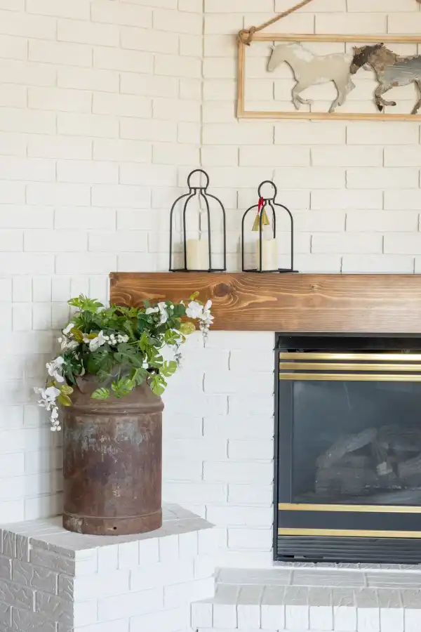 White-brick hearth in a living room remodeled by PDQ
