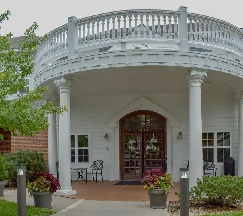 White-columned portico and balcony on a commercial building remodel